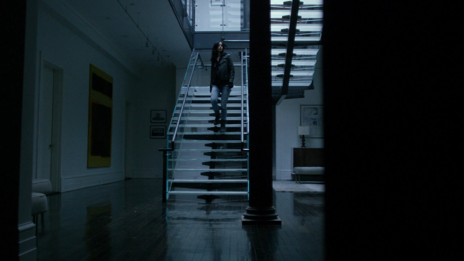 Jessica on stairs inside Kilgrave's apartment.