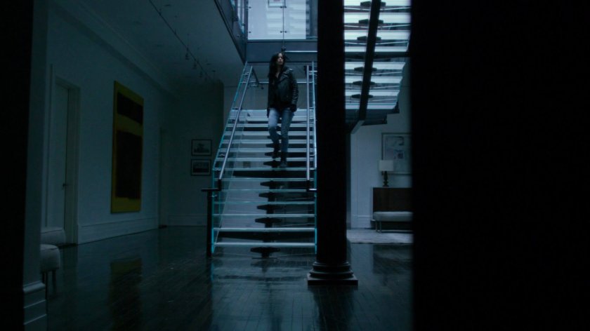 Jessica on stairs inside Kilgrave's apartment.
