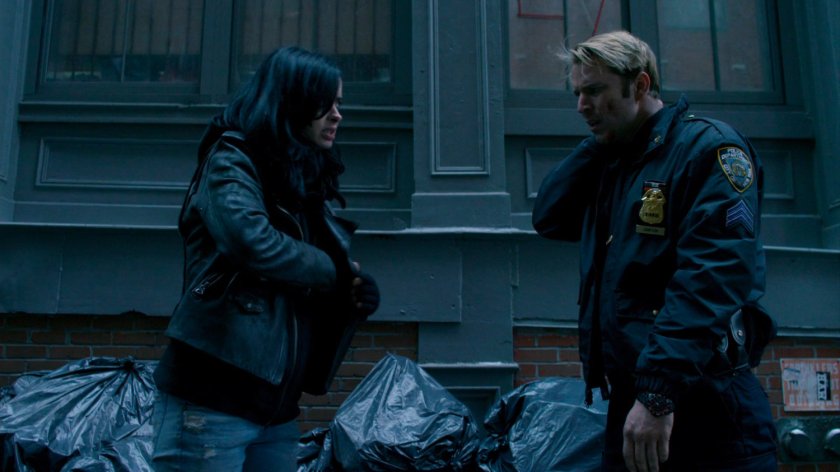 Jessica and Officer Simpson in alley.