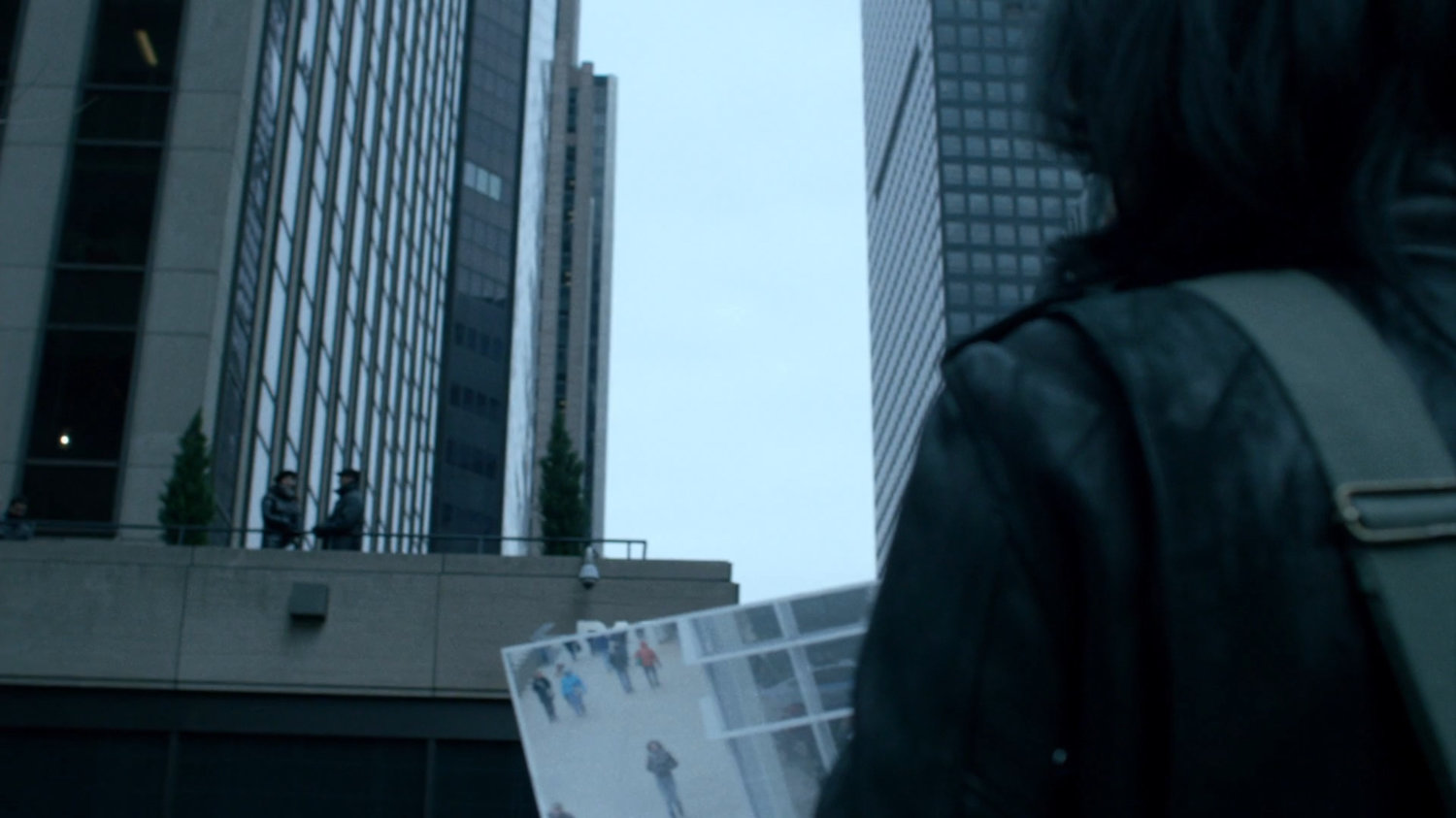 Jessica on sidewalk outside Bank of America tower.