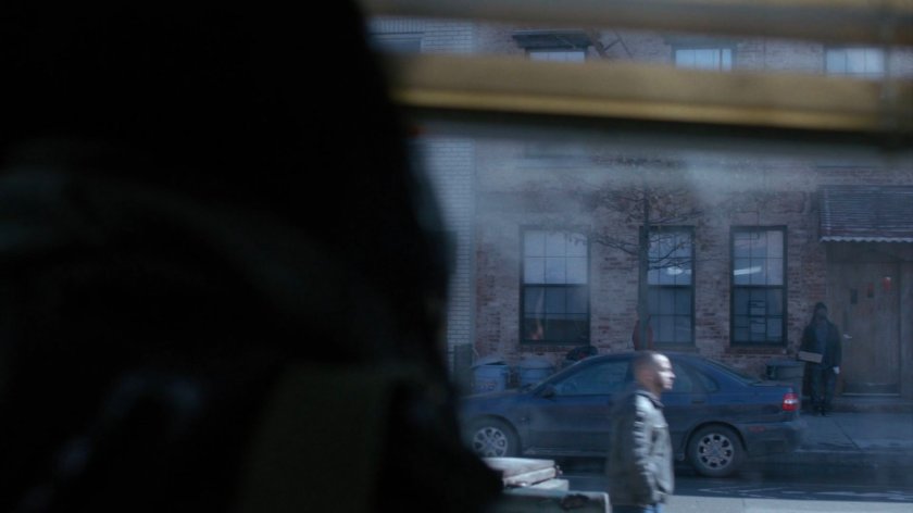 Jessica watching Audrey Eastman walk by on sidewalk across street.
