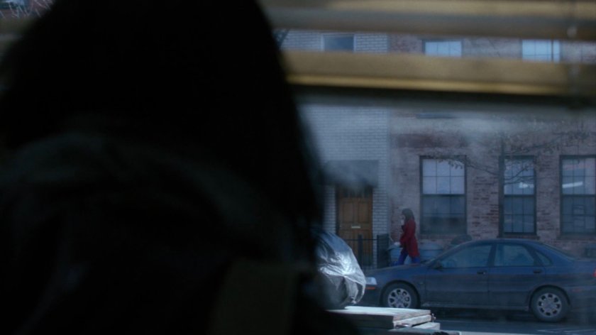 Jessica watching Audrey Eastman walk by on sidewalk across street.