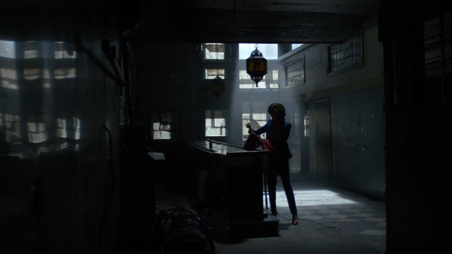 Audrey Eastman inside abandoned bar.