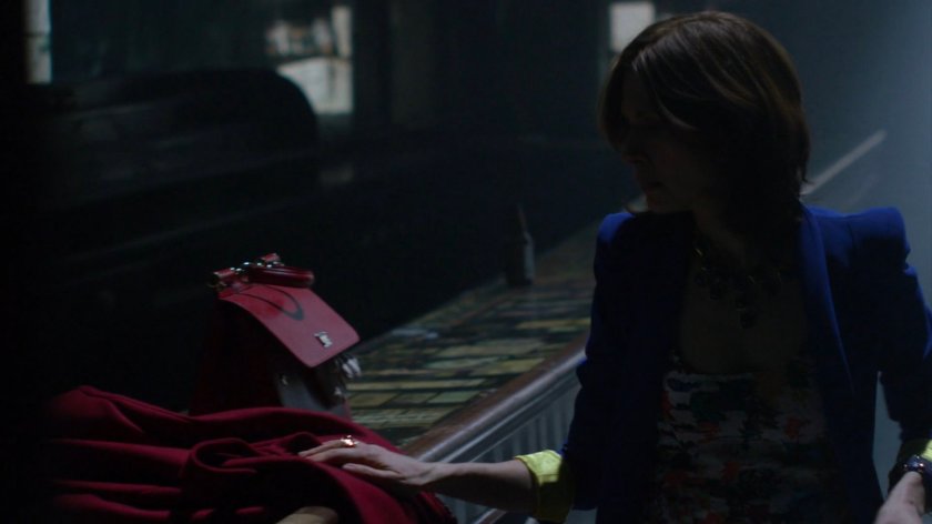 Audrey Eastman inside abandoned bar.