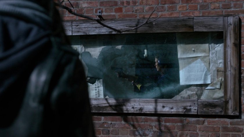 Jessica observing Audrey Eastman inside abandoned bar.