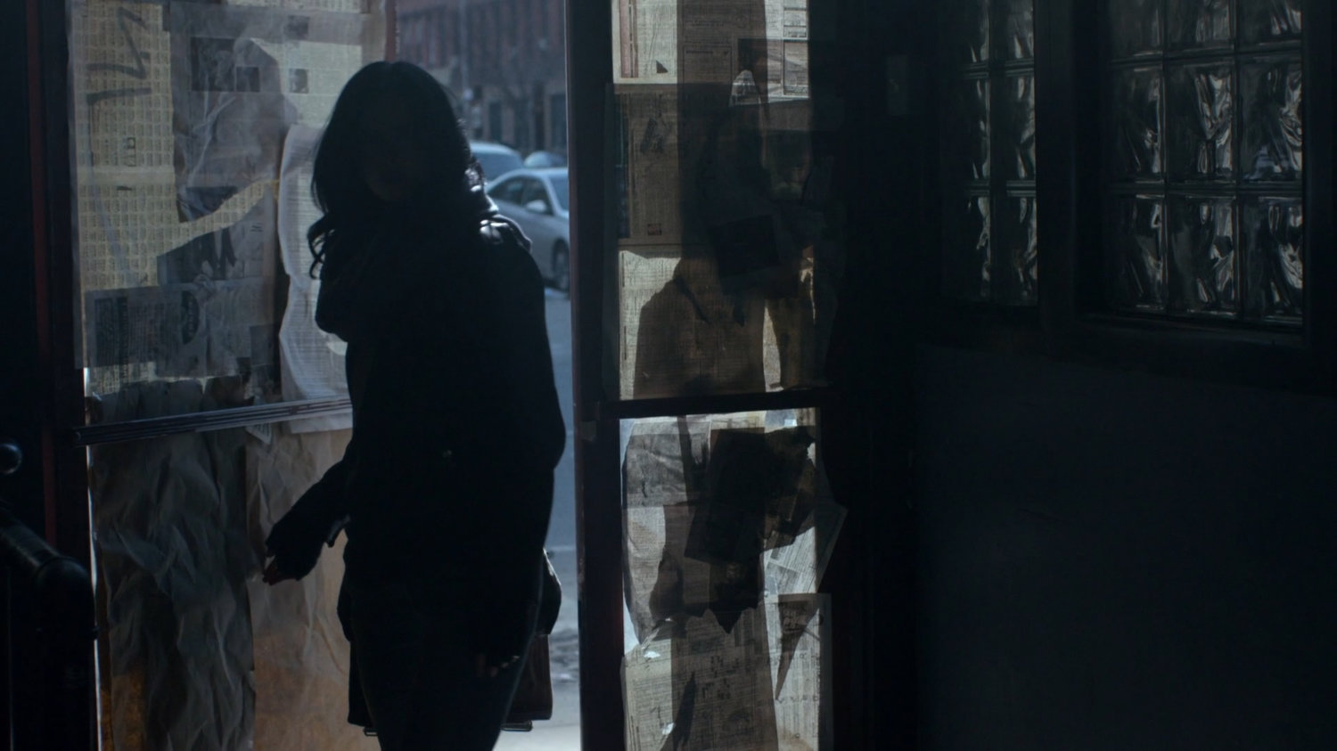 Jessica entering abandoned bar.