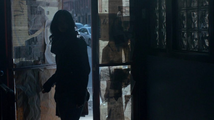 Jessica entering abandoned bar.