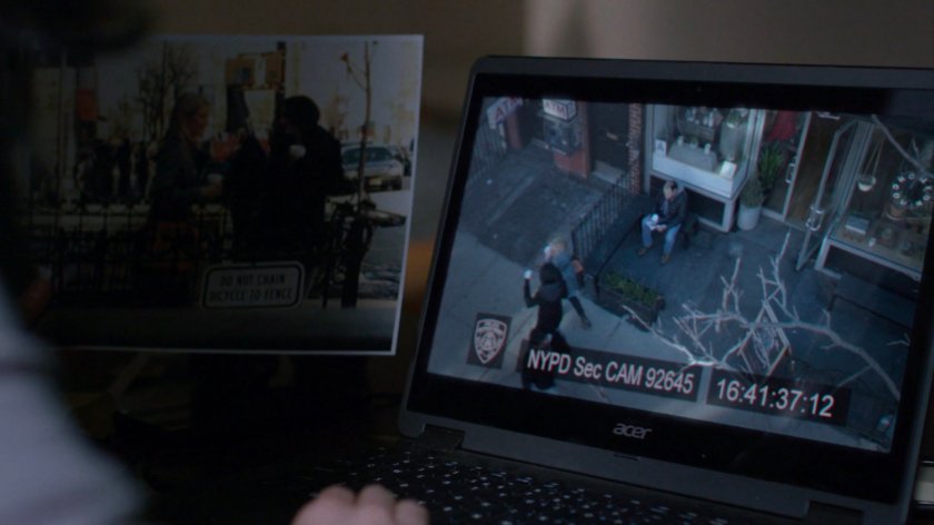 Jessica comparing surveillance footage of her and Trish to a photo.