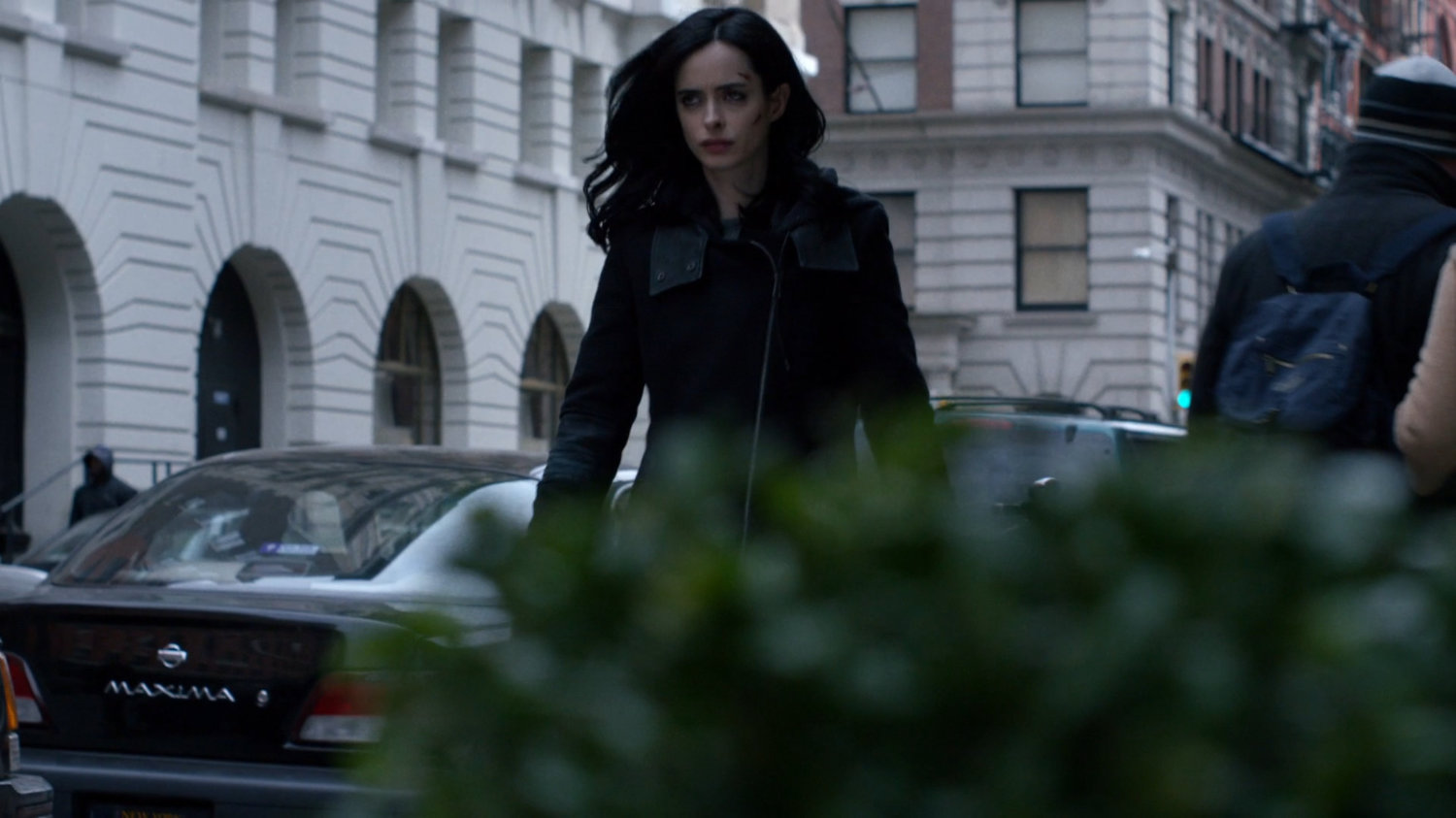 Jessica walking along sidewalk in Tribeca.