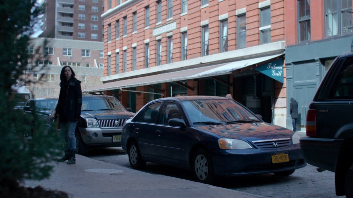 Jessica pausing on sidewalk for young girl calling her name.