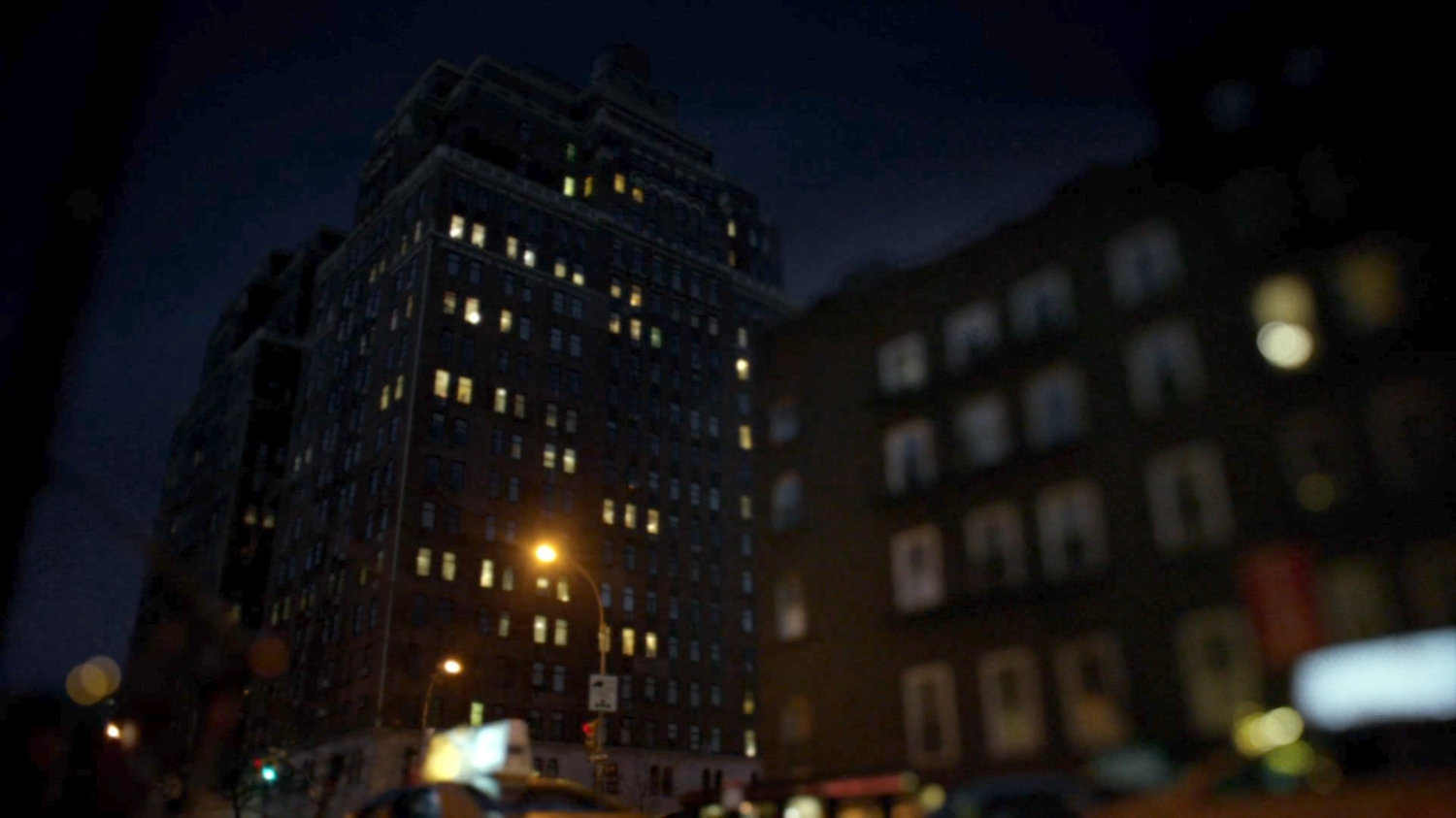 Nighttime view of Trish Walker's building.