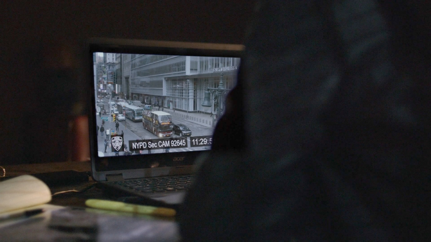 Jessica watching security footage.