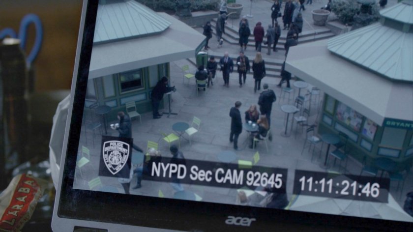 Jessica watching security footage of herself in Bryant Park.