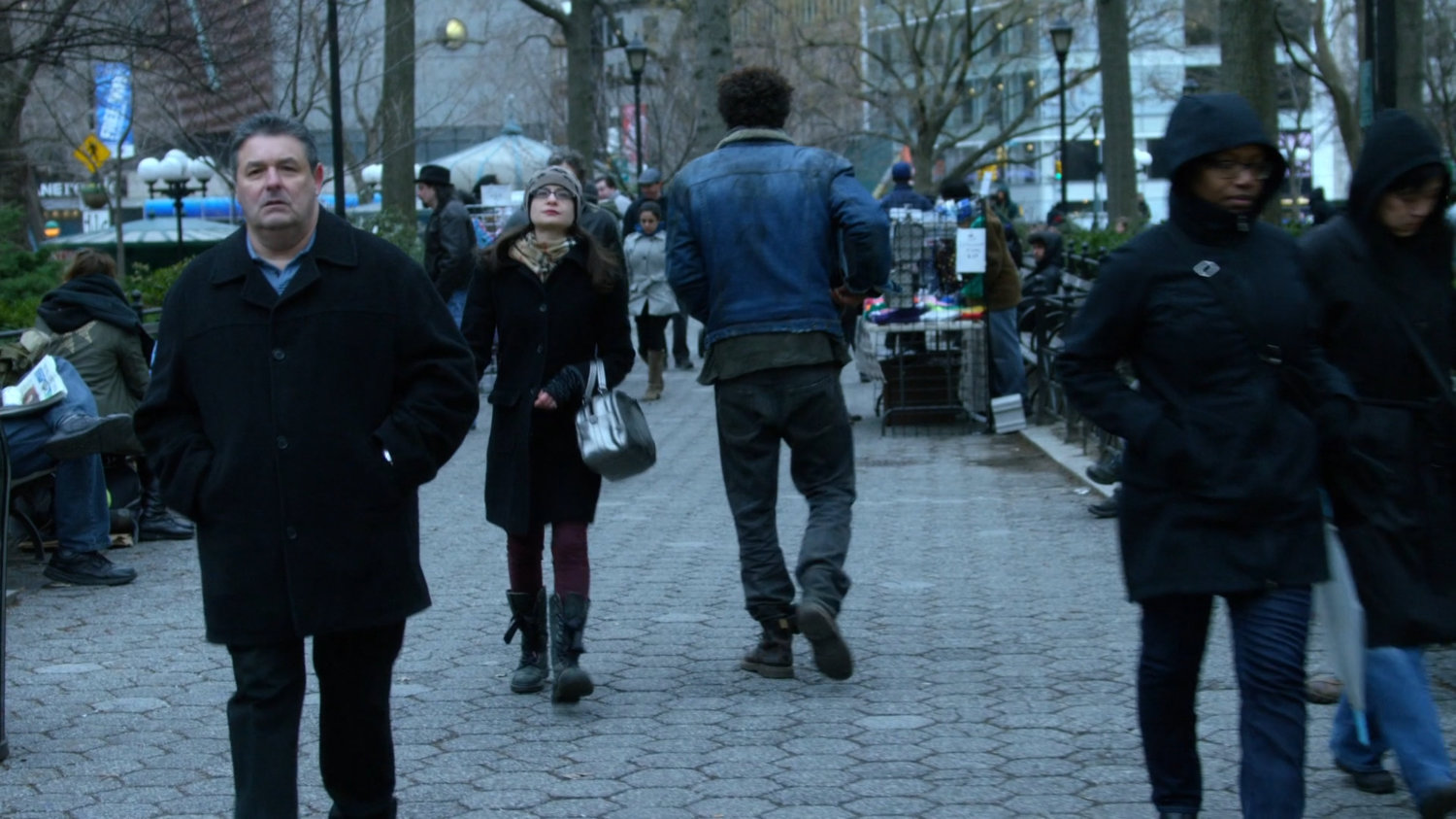 Malcolm walking through Union Square Park.