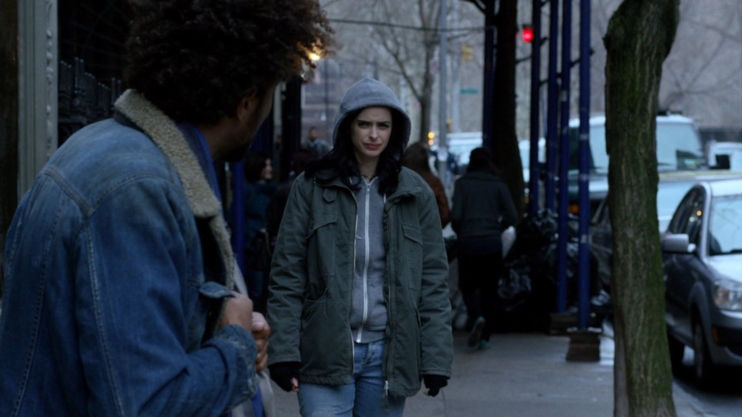 Jessica and Malcolm on sidewalk outside Alias Investigations building.