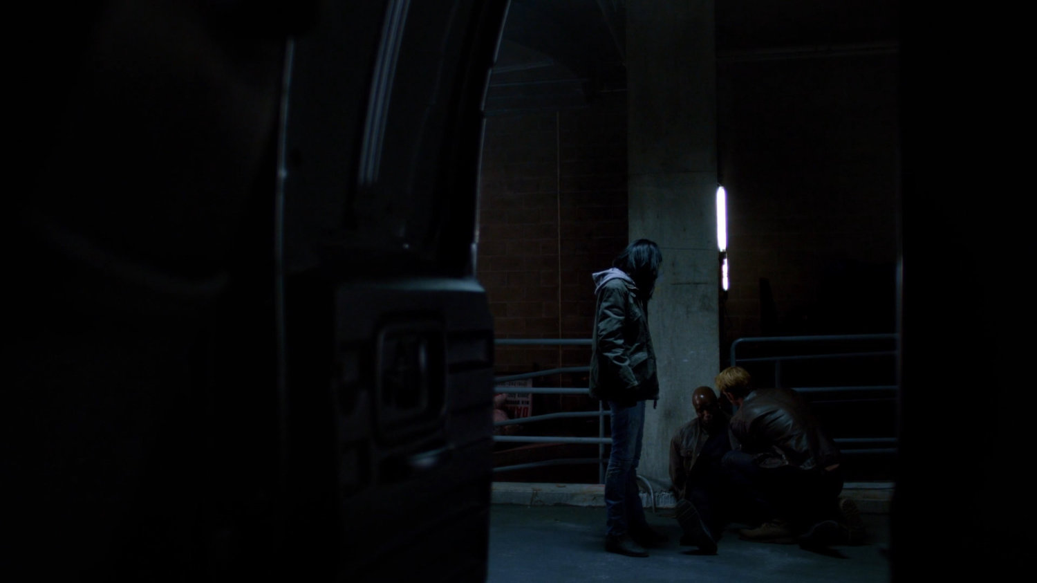 Jessica and Will question a bodyguard at a decommissioned CDC facility.