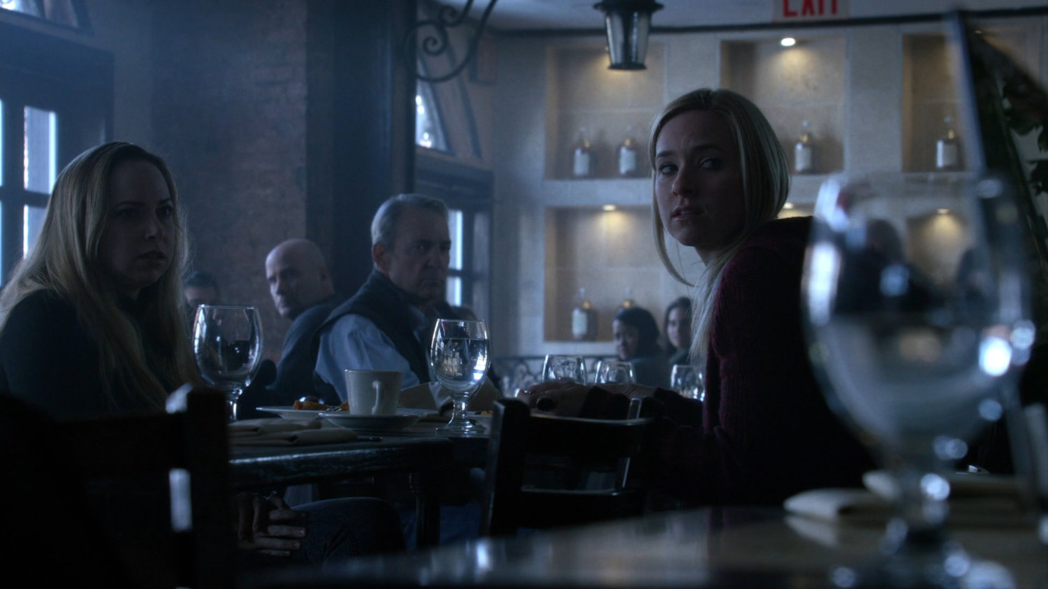 Patrons staring at Kilgrave in a restaurant.