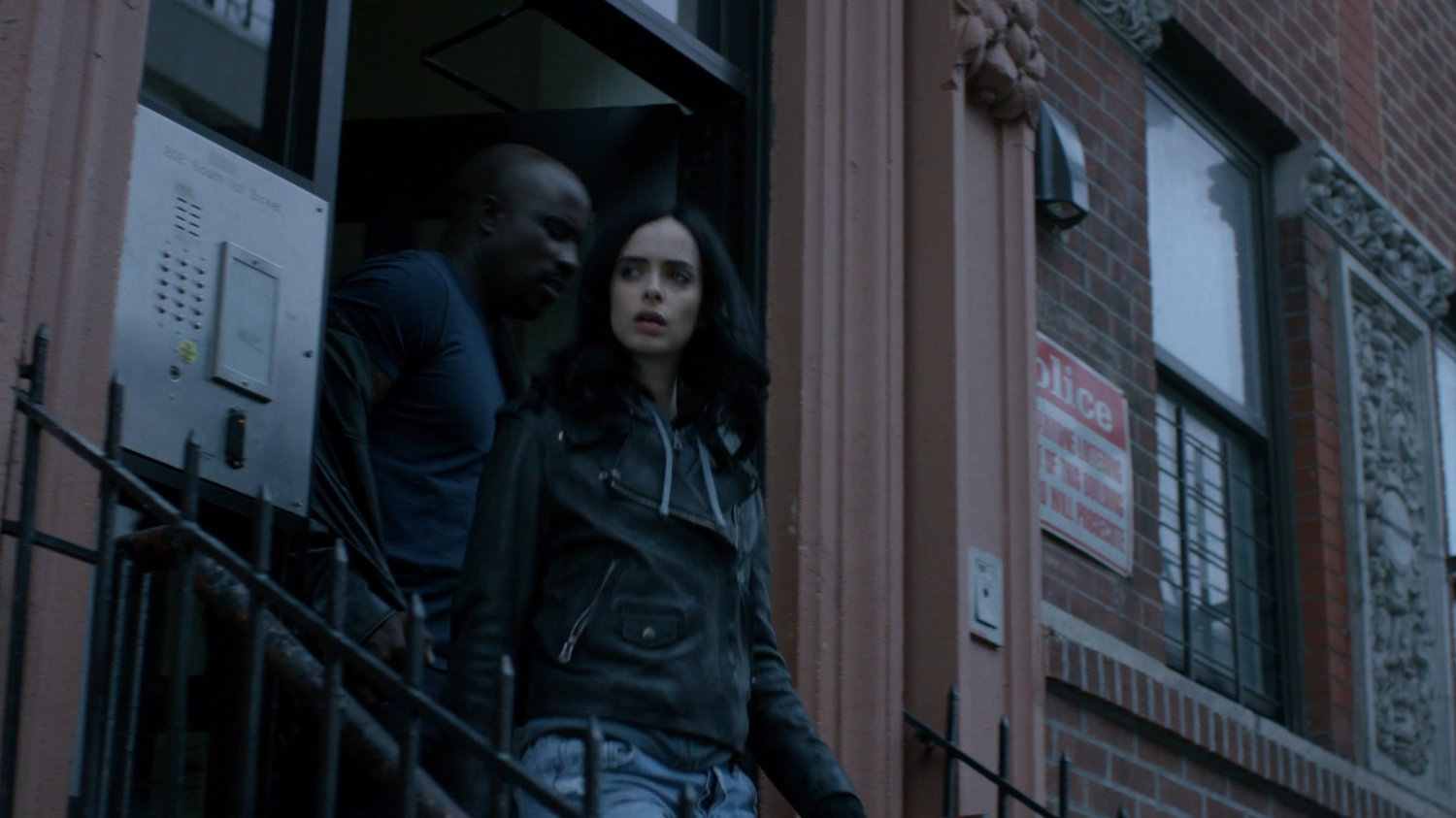 Jessica and Luke exiting Antoine Grier's apartment building.