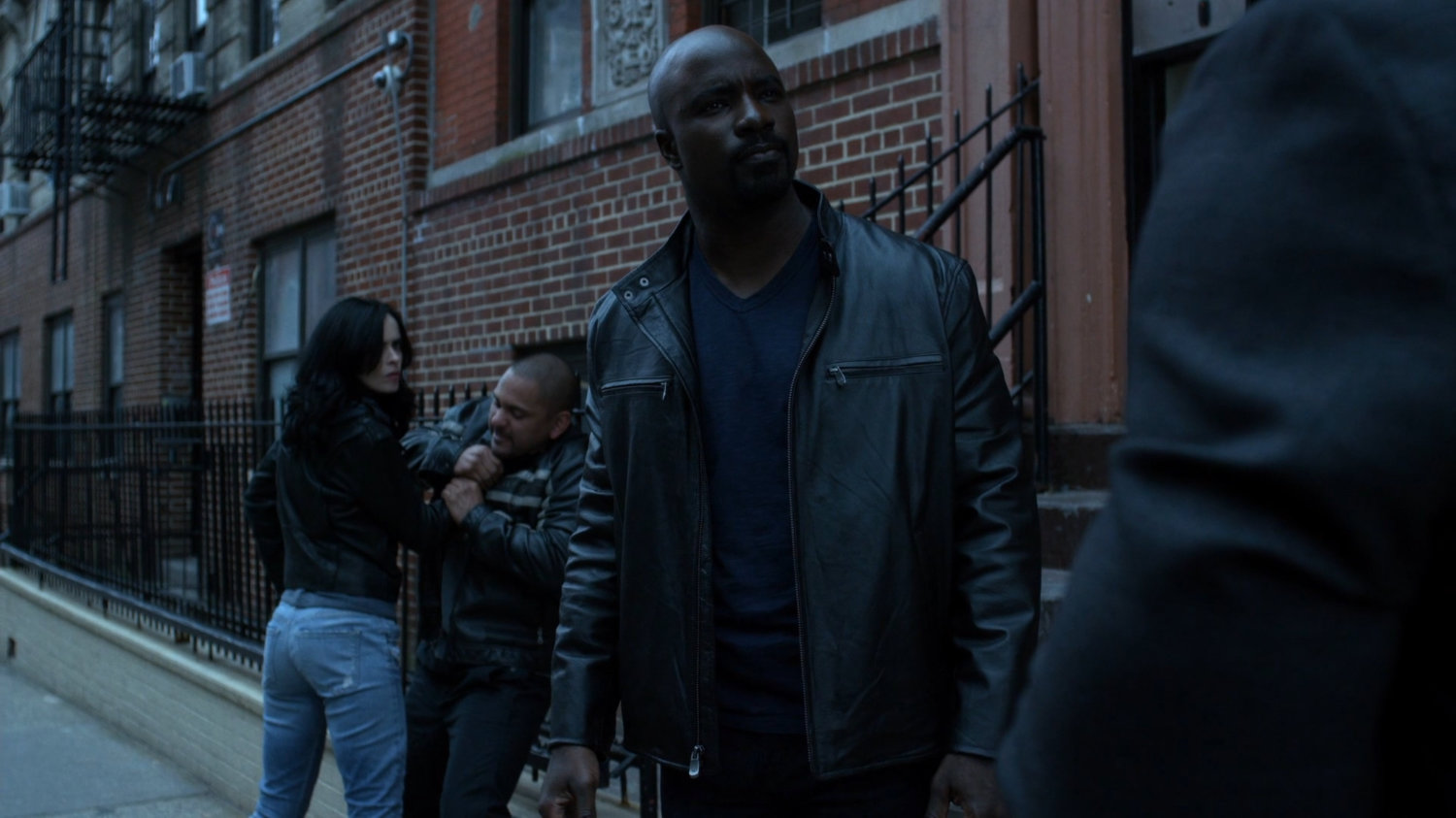 Jessica and Luke in front of Antoine Grier's apartment building.