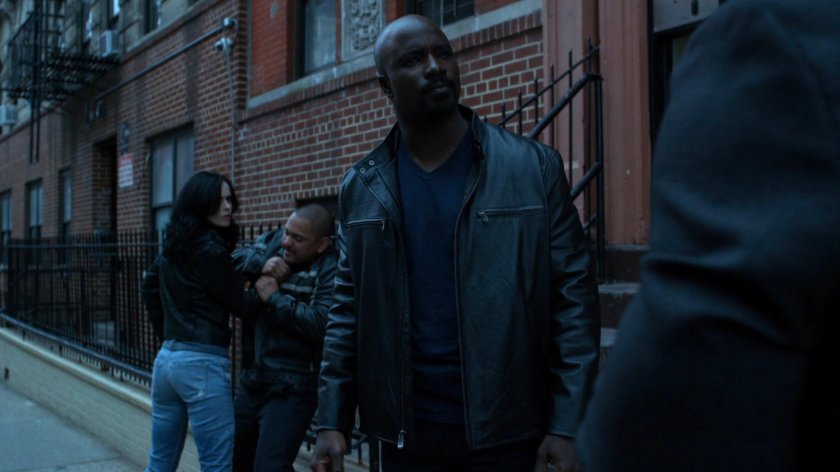 Jessica and Luke in front of Antoine Grier's apartment building.