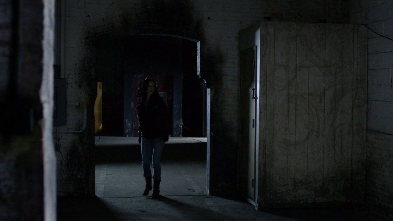 Jessica walking through the warehouse.