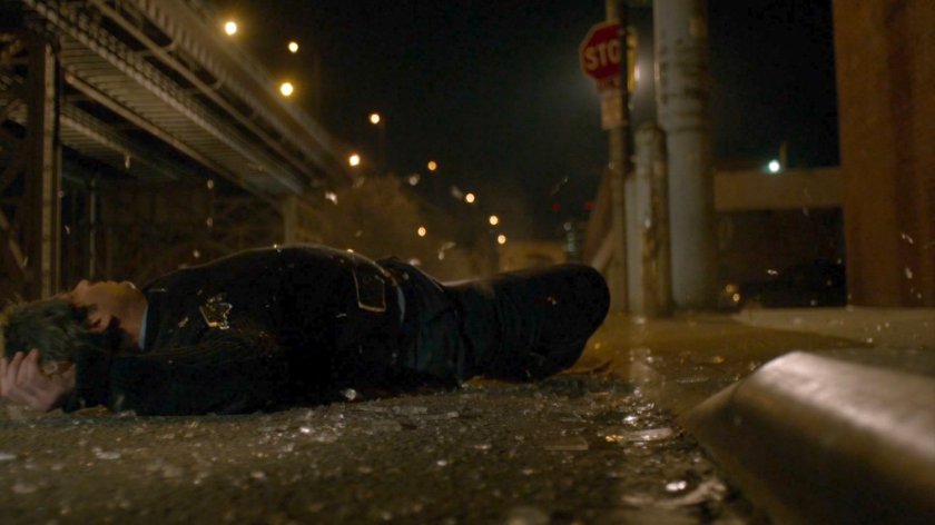 Bus driver landing on street covered in broken glass.