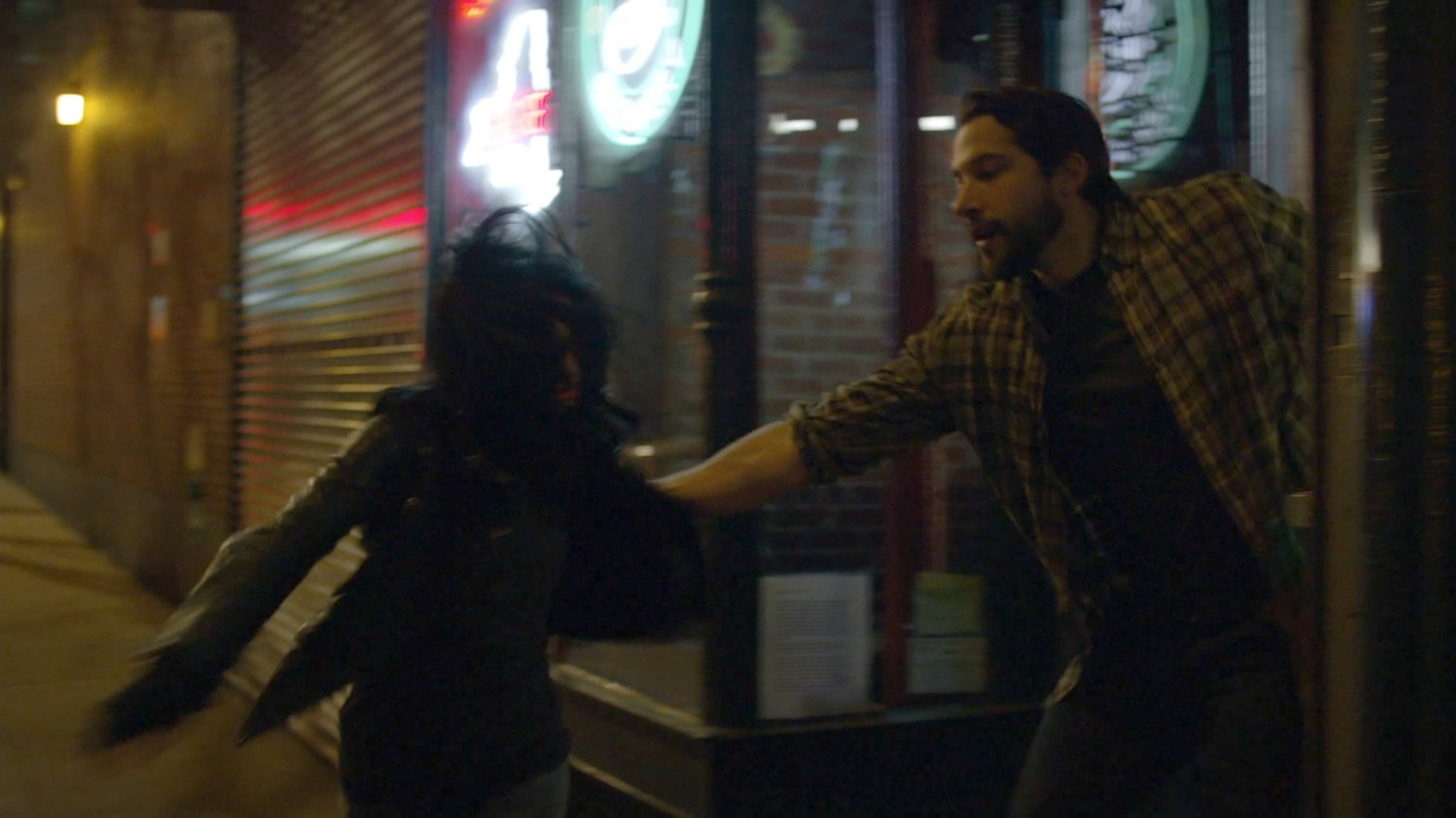 Jessica being "escorted" out of a bar.