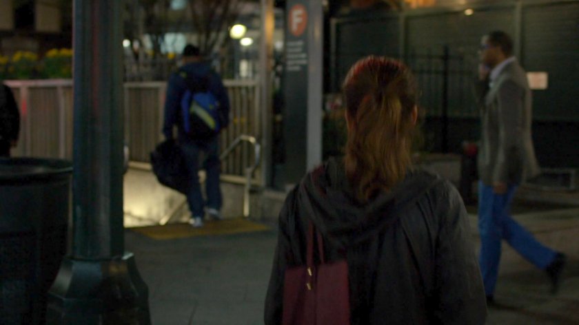 Wendy entering a subway station.