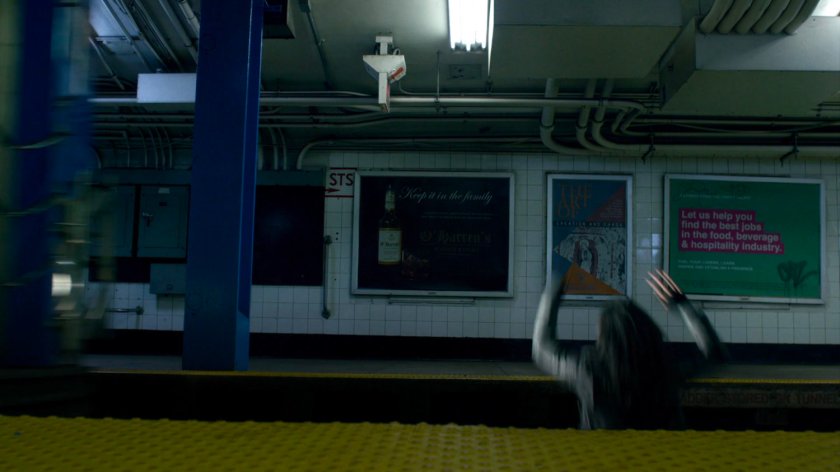 Jessica jumping clear of subway train.