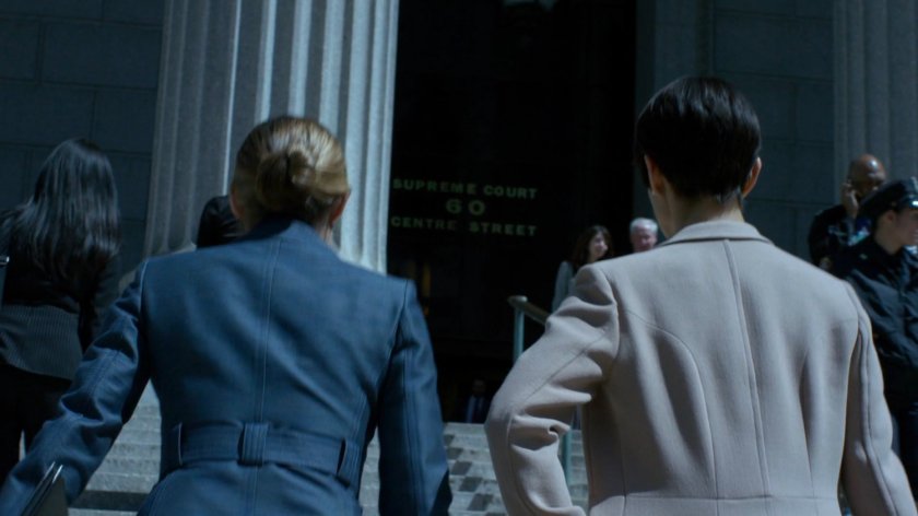 Jeri and Pam walking up steps to courthouse.