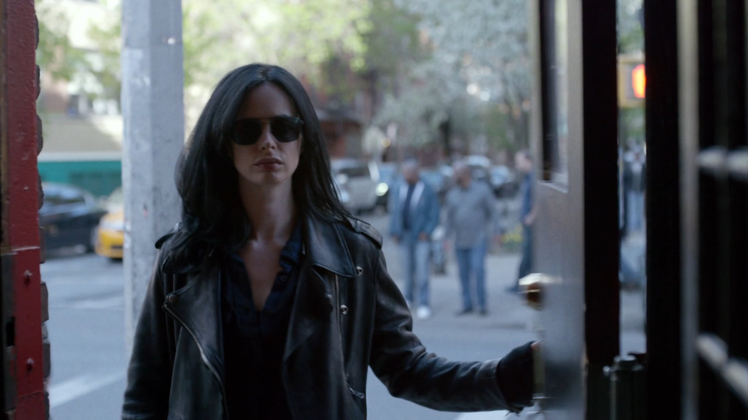 Jessica standing in the doorway to Luke's bar.