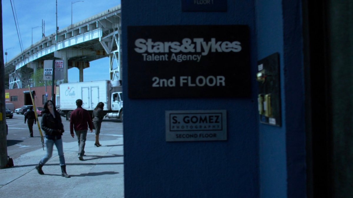 Jessica approaching entrance to Stars & Tykes Talent Agency.