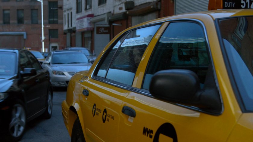 Jessica stuck in a taxi cab during traffic jam.