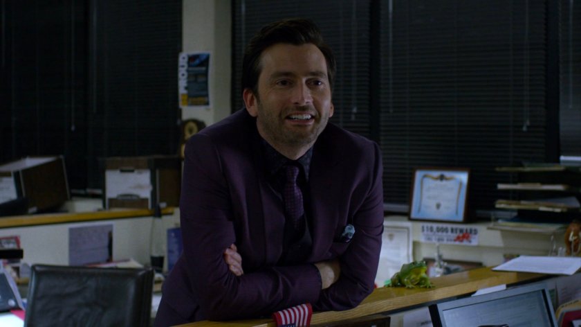 Kilgrave in the 15th Precinct police station.
