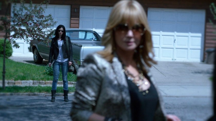 Jessica seeing Dorothy in a flashback outside her childhood home.