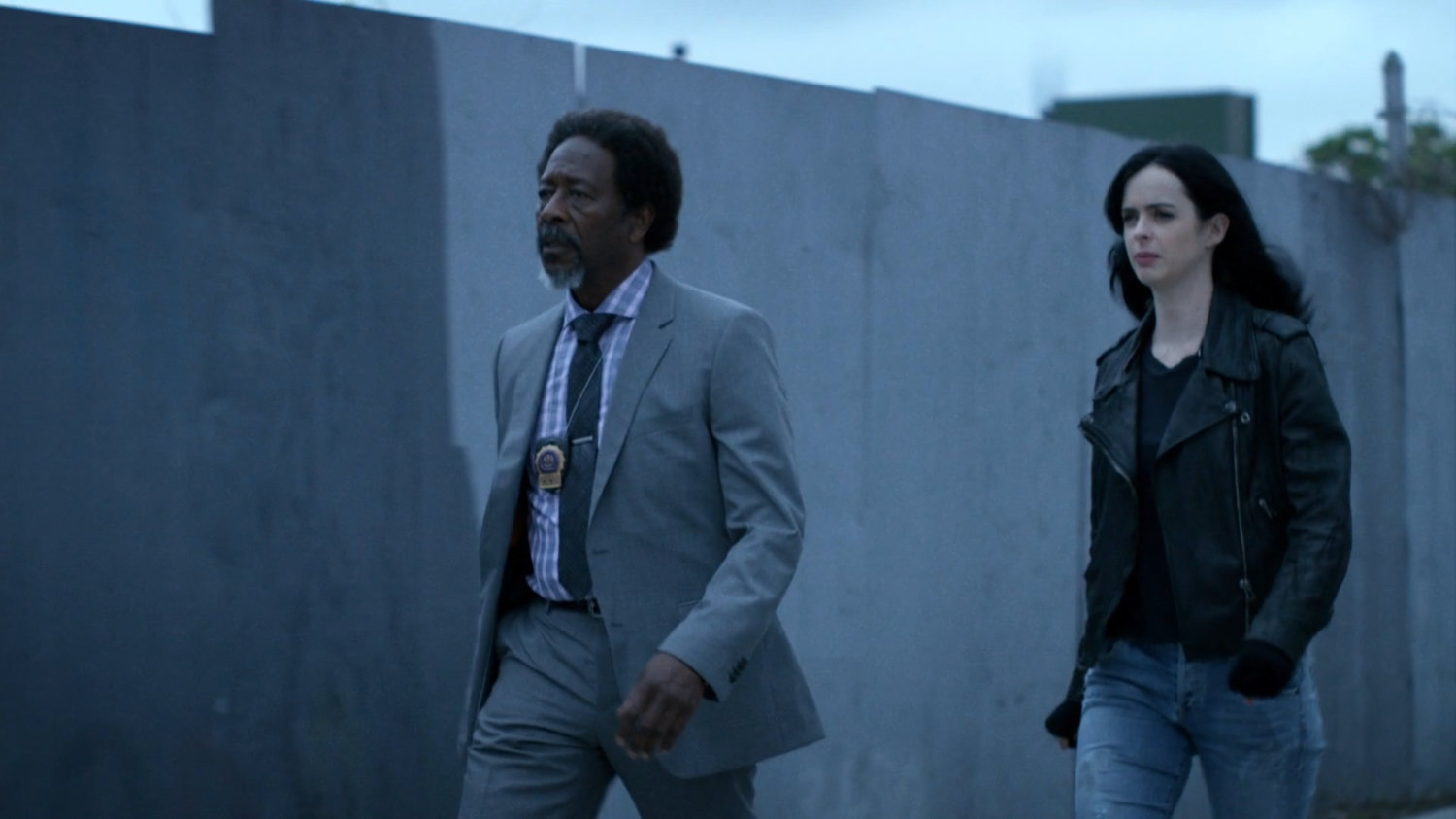 Jessica and Detective Clemons on a sidewalk.