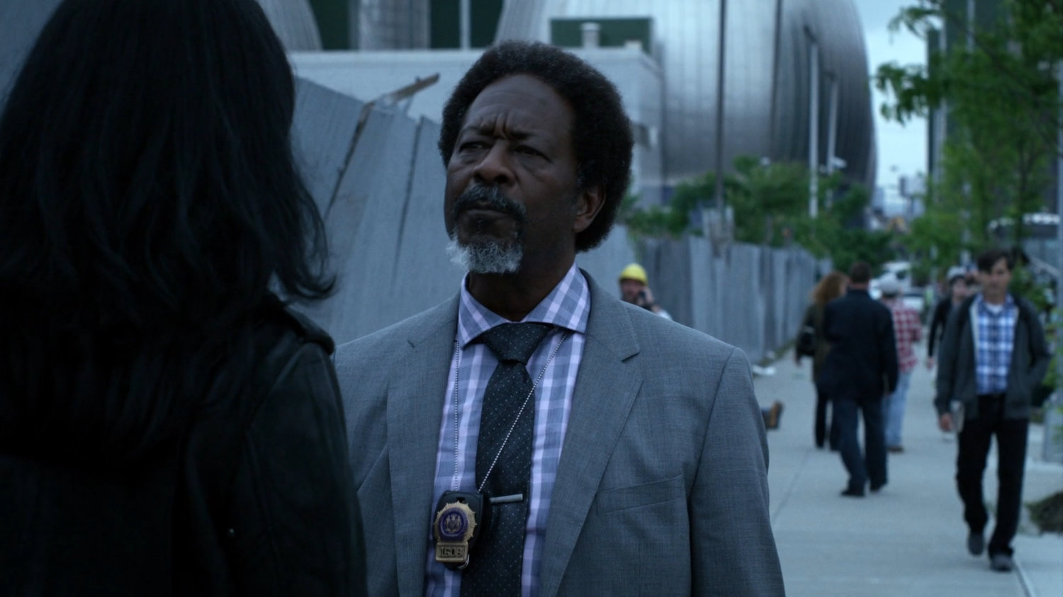 Jessica and Detective Clemons on a sidewalk.