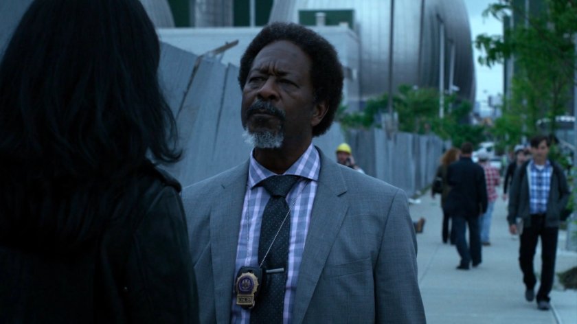 Jessica and Detective Clemons on a sidewalk.