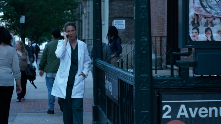 Wendy on a cell phone outside 2 Avenue Subway entrance.