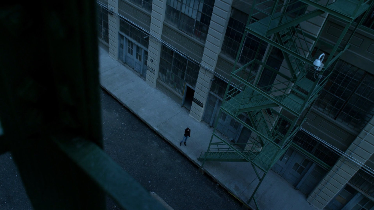 High angle view of Jessica on the phone outside the CDC Facility.