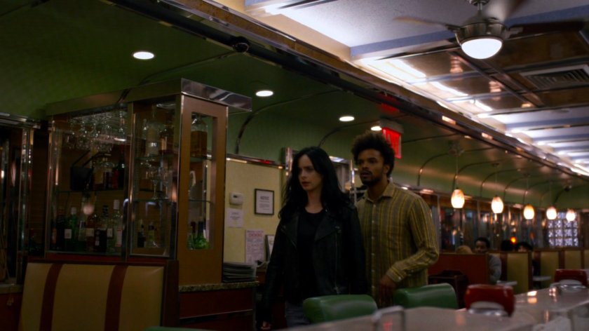 Malcolm and Jessica inside Court Square Diner at night.