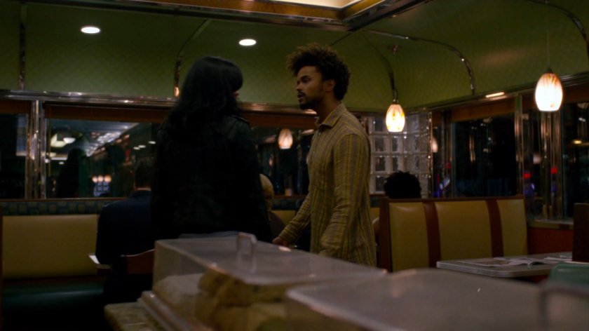 Malcolm and Jessica inside Court Square Diner at night.