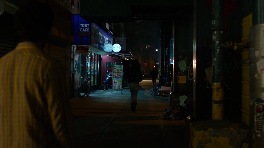 Jessica and Malcolm outside Court Square Diner at night.