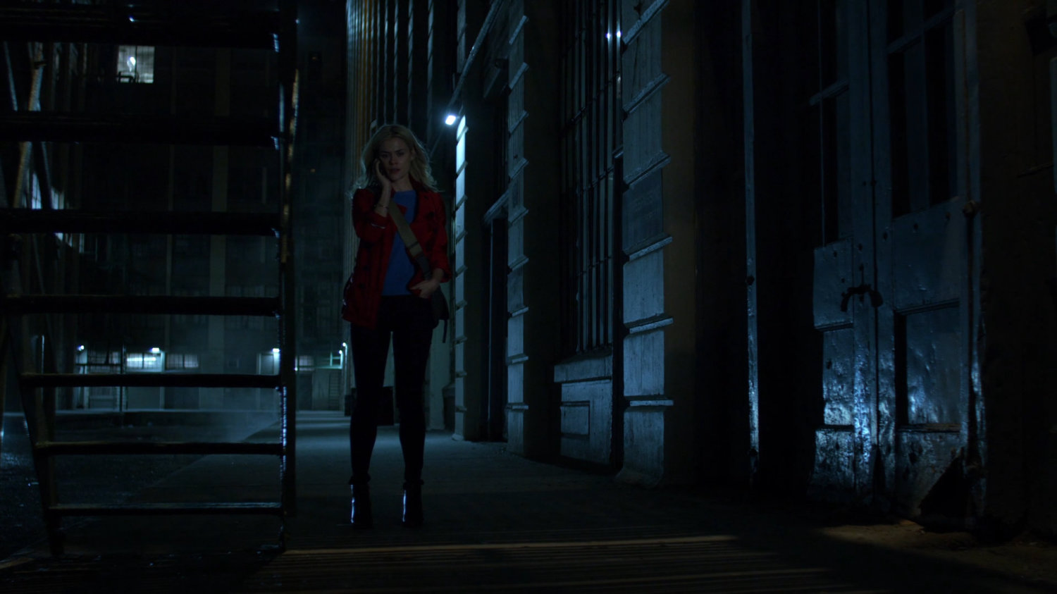 Trish on phone outside of CDC facility at night.