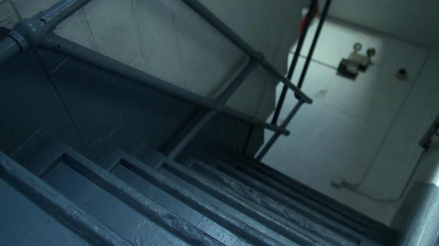 Kilgrave running down stairway inside CDC Facility.