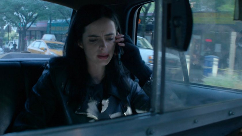 Jessica in the back of a taxi cab.