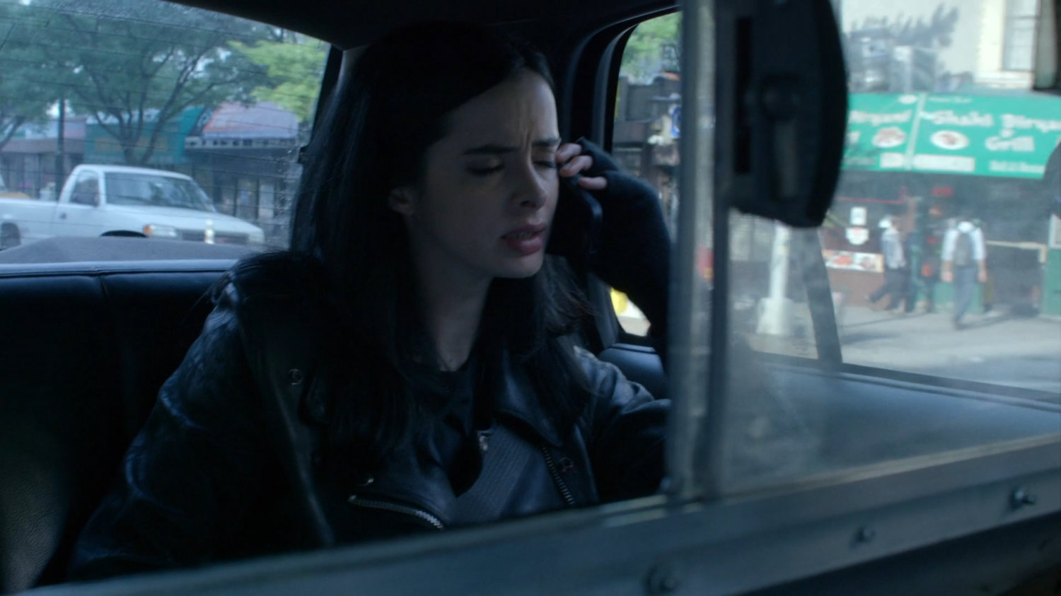Jessica in the back of a taxi cab.