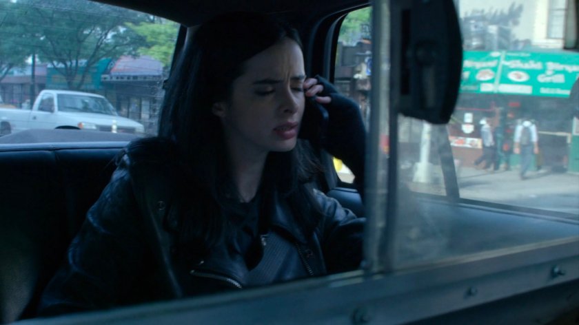 Jessica in the back of a taxi cab.