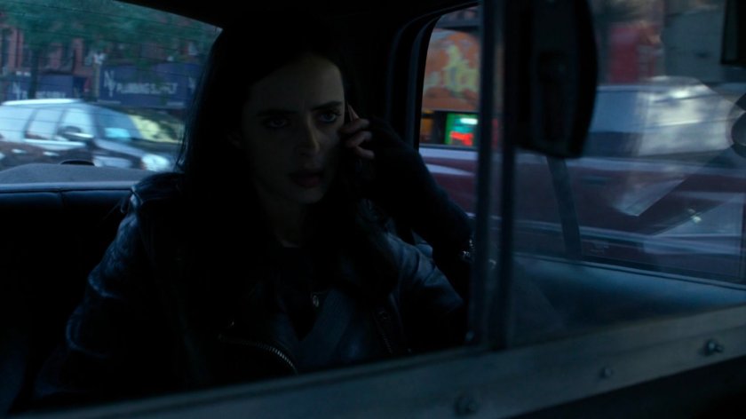 Jessica in the back of a taxi cab.