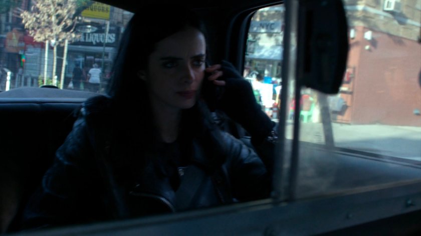 Jessica in the back of a taxi cab.